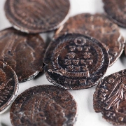 Copper coin hoard found in underground complex at Huqoq, Lower Galilee. Credit: Emil Aladjem, Israel Antiquities Authority.
