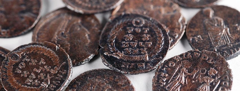 Copper coin hoard found in underground complex at Huqoq, Lower Galilee. Credit: Emil Aladjem, Israel Antiquities Authority.
